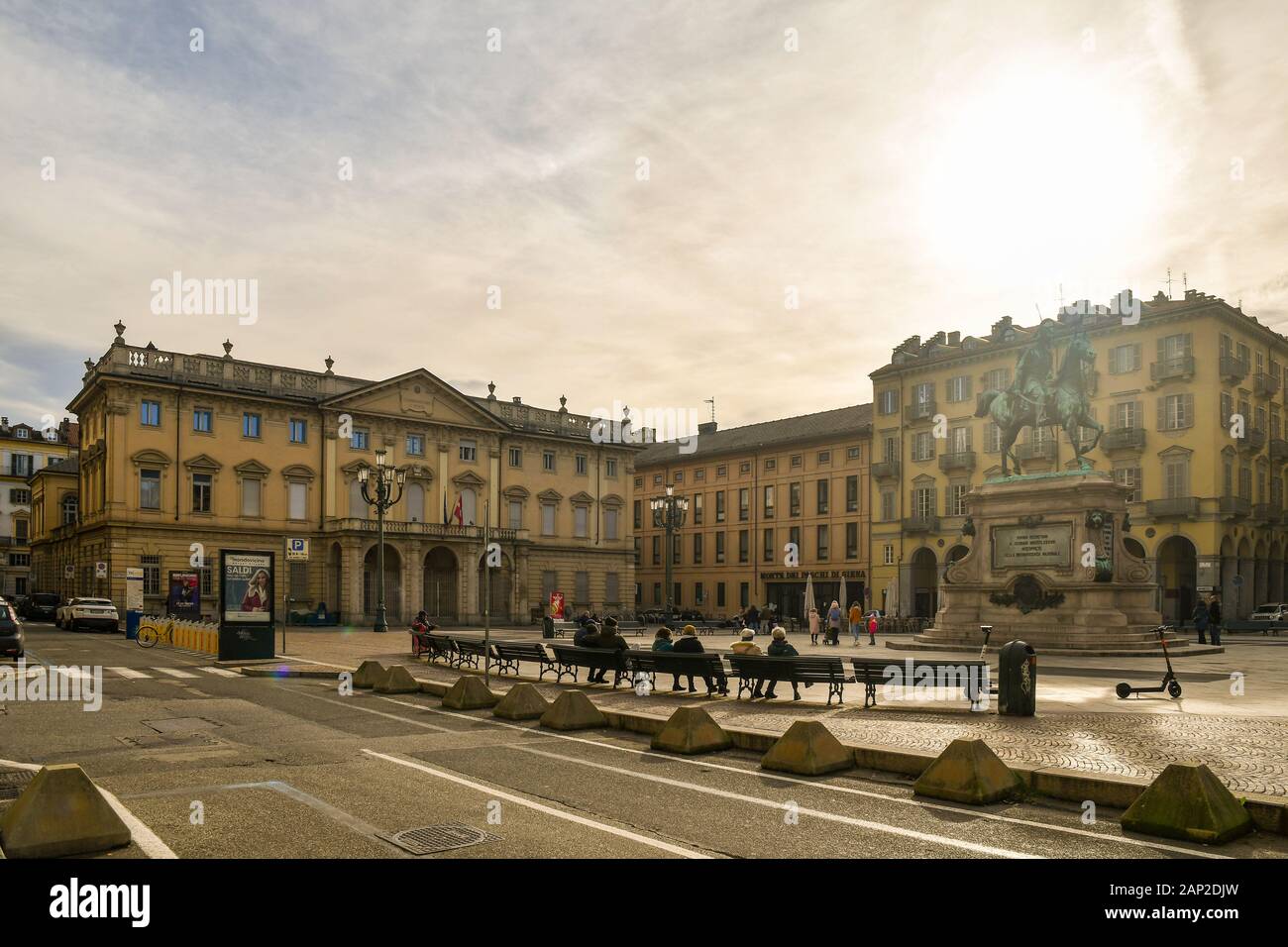 Backlight view of Piazza Giambattista Bodoni with the Giuseppe Verdi Conservatory and the monument to Alfonso Lamarmora, Turin, Piedmont, Italy Stock Photo