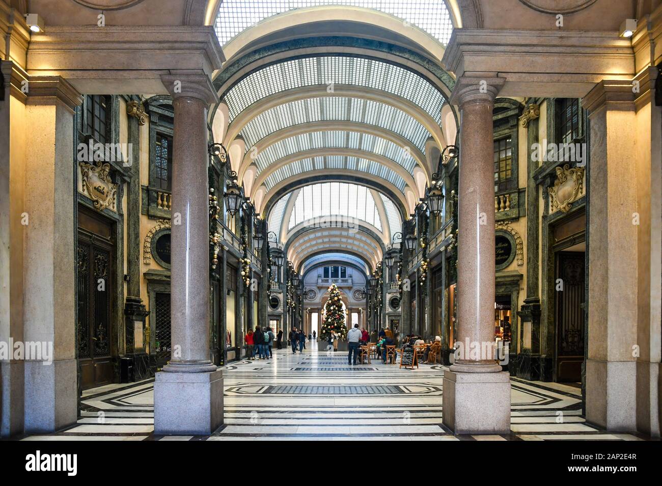 Galleria San Federico, shopping gallery in the historic centre of Turin, with a Christmas tree and people walking in December, Piedmont, Italy Stock Photo