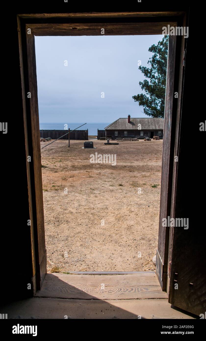 View through a doorway framing a view of Fort Ross State Historic Park on the Sonoma Coast of California Stock Photo