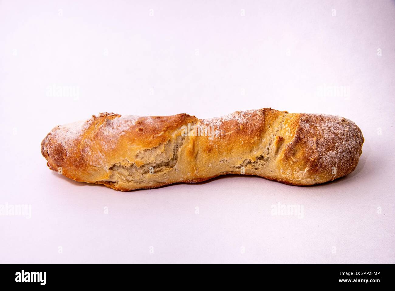 Home baked baguette loaf on a white background Stock Photo - Alamy