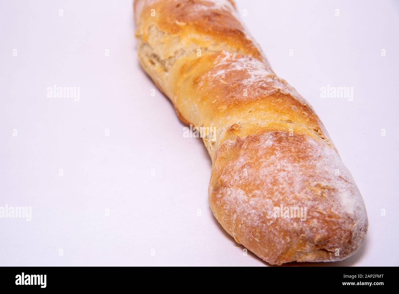 Home baked baguette loaf on a white background Stock Photo - Alamy