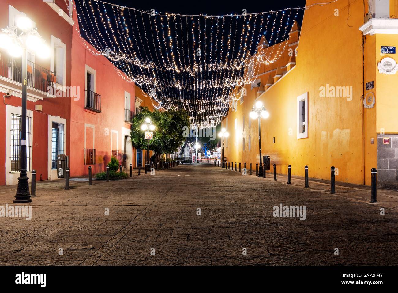 Puebla de Zaragoza, Mexico, October 15, 2018 - Calle 8 Norte street of Puebla city with light decoration without cars and people at night Stock Photo