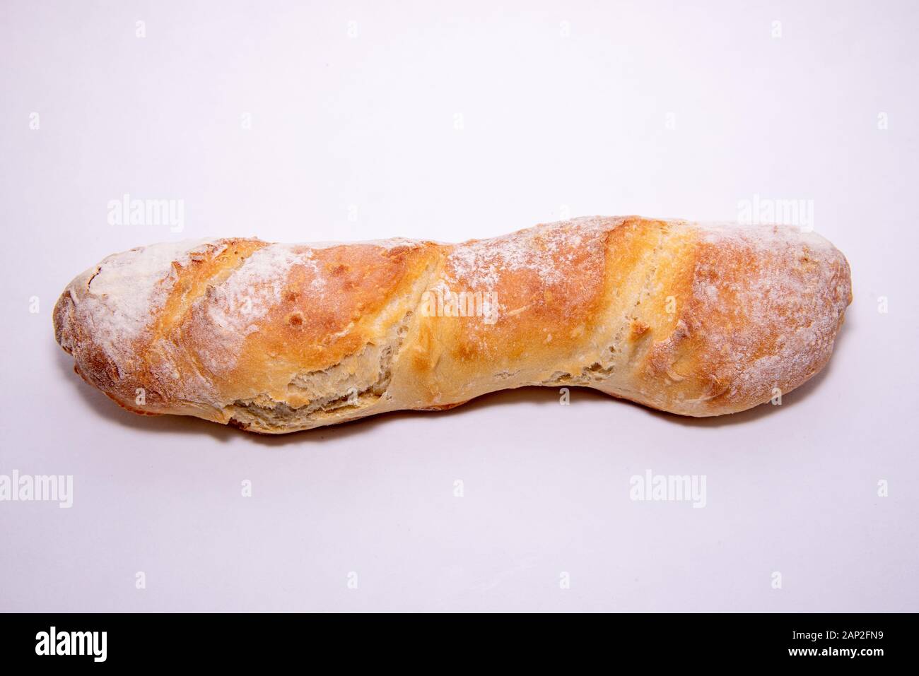 Home baked baguette loaf on a white background Stock Photo - Alamy