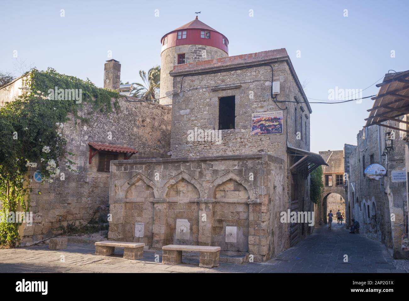 Three fountains on the facade of an old building in the medieval city inside of Fortifications of Rhodes. Stock Photo