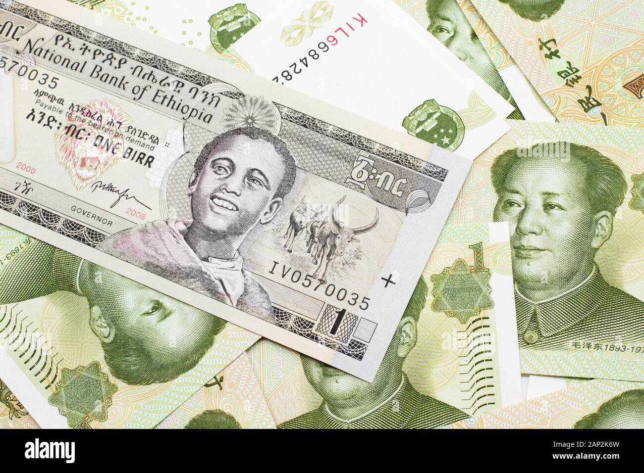 A close up image of a one Ethiopian birr bank note on a background of  Chinese one yuan bank notes Stock Photo - Alamy