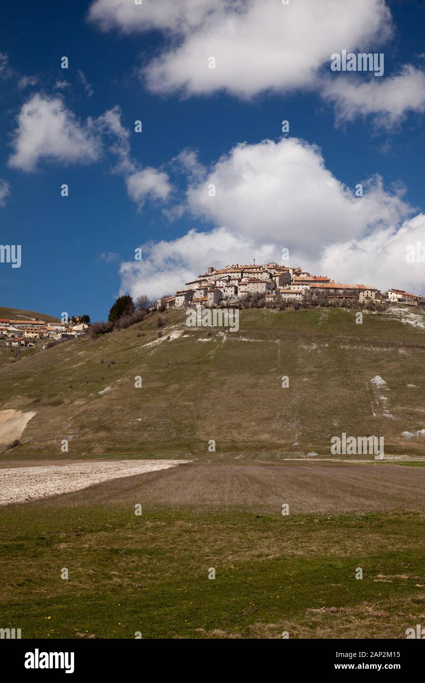 Castelluccio, the highest village in the Apennines perched above the Piano Grande in spring sunshine (pre 2016/7 earthquakes) Stock Photo