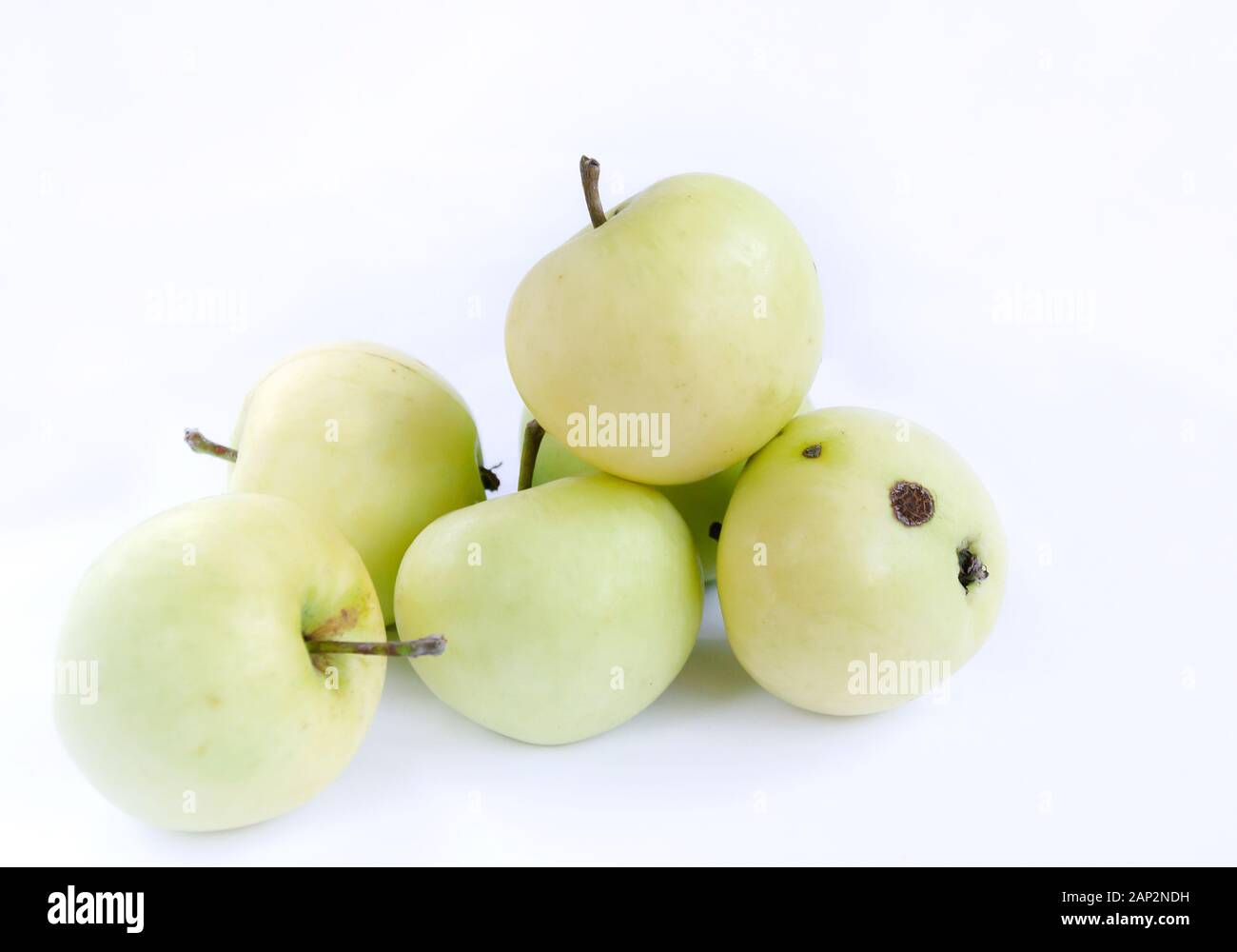fruit of apple tree, yellow, isolated on white background closeup