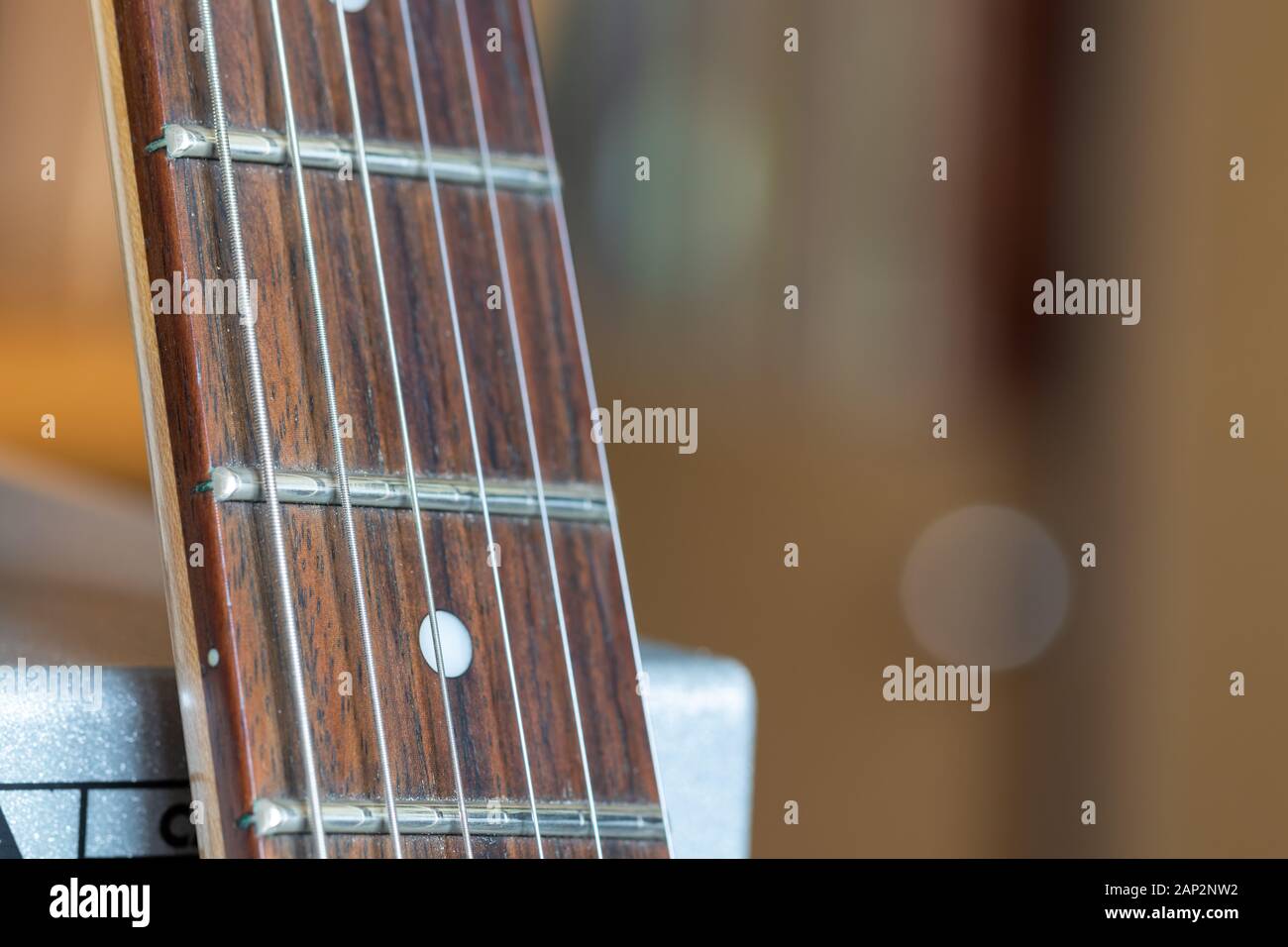 Close look over guitar neck. Stock Photo