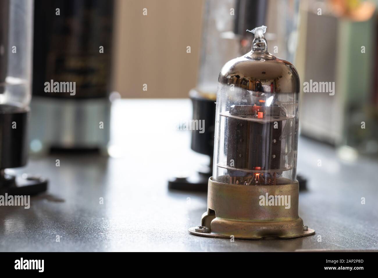 Audio tubes on a hand made guitar AMP. Stock Photo