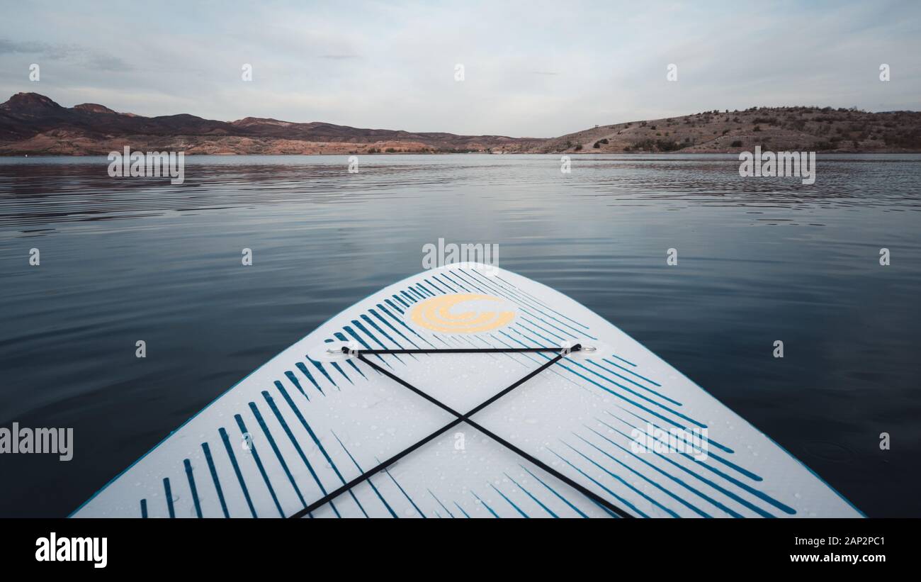 The front of a stand up paddle board on a lake (Lake Mead) in Nevada, USA Stock Photo