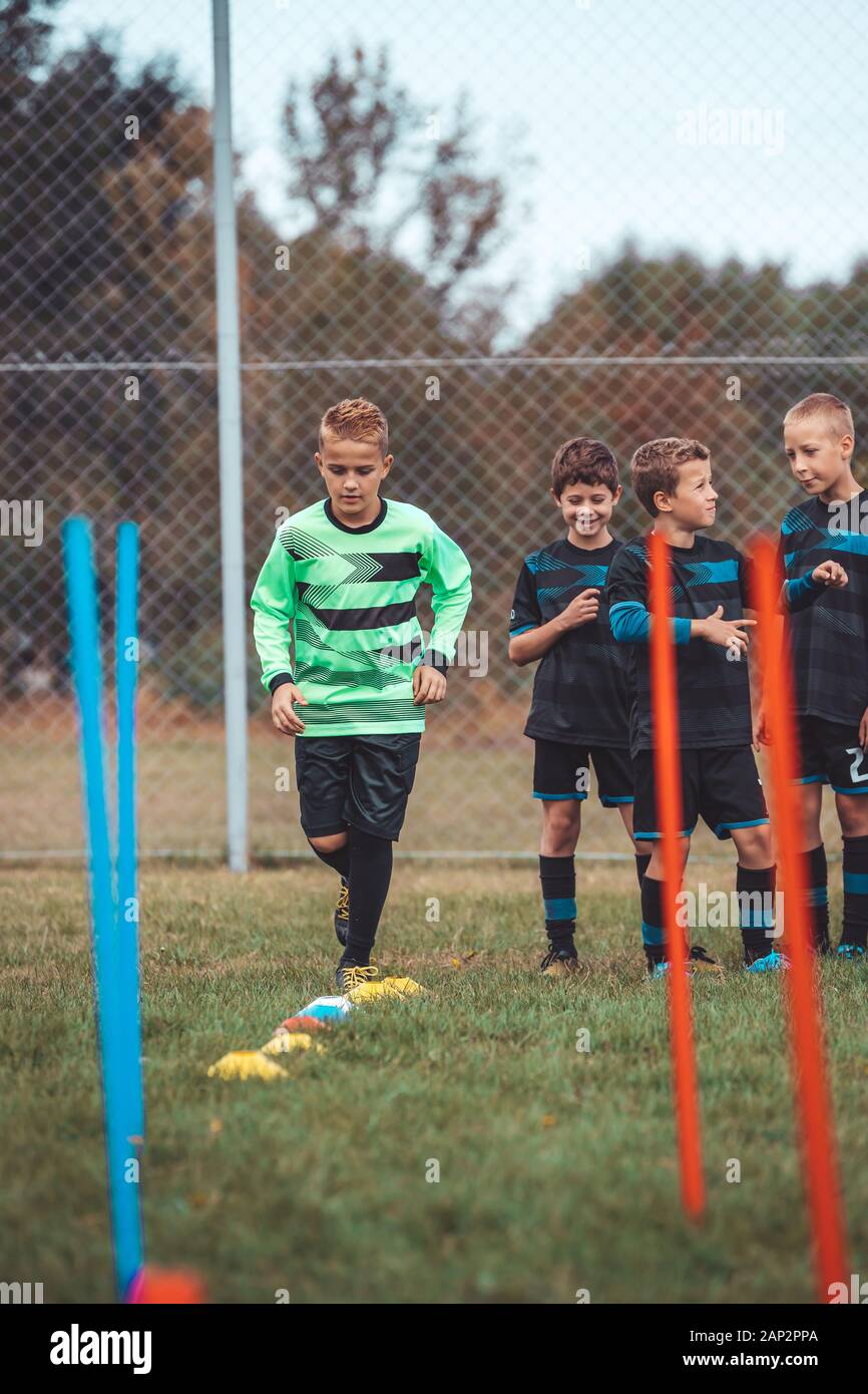 Soccer Drills The Slalom Drill Youth Soccer Practice Drills Young Football Player Training On Pitch Soccer Slalom Cone Drill Boy In Soccer Jerse Stock Photo Alamy
