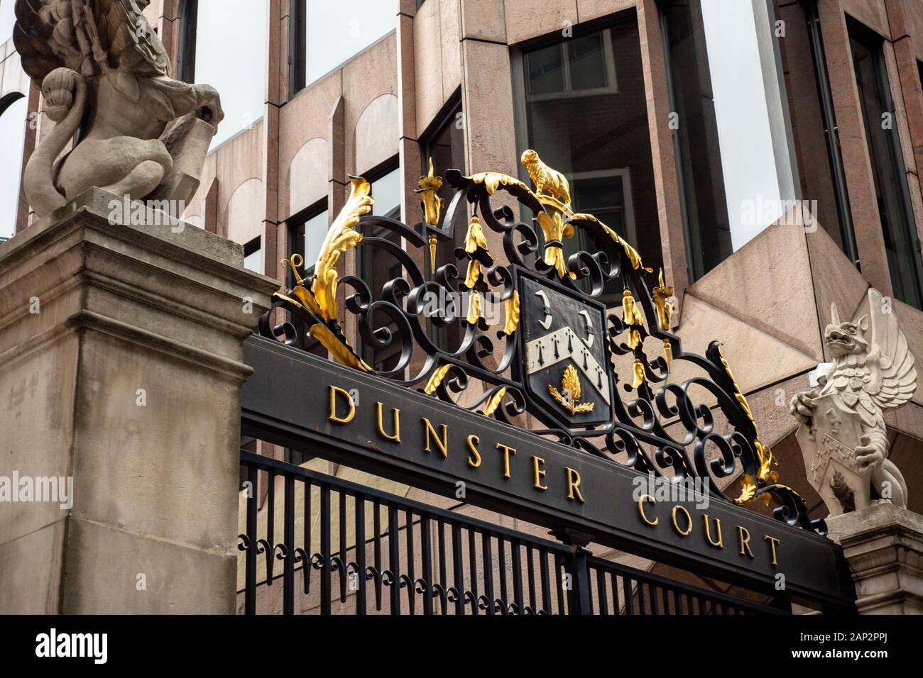 Dunster Court ornate gate and the Clothworkers' Company coat of arms as