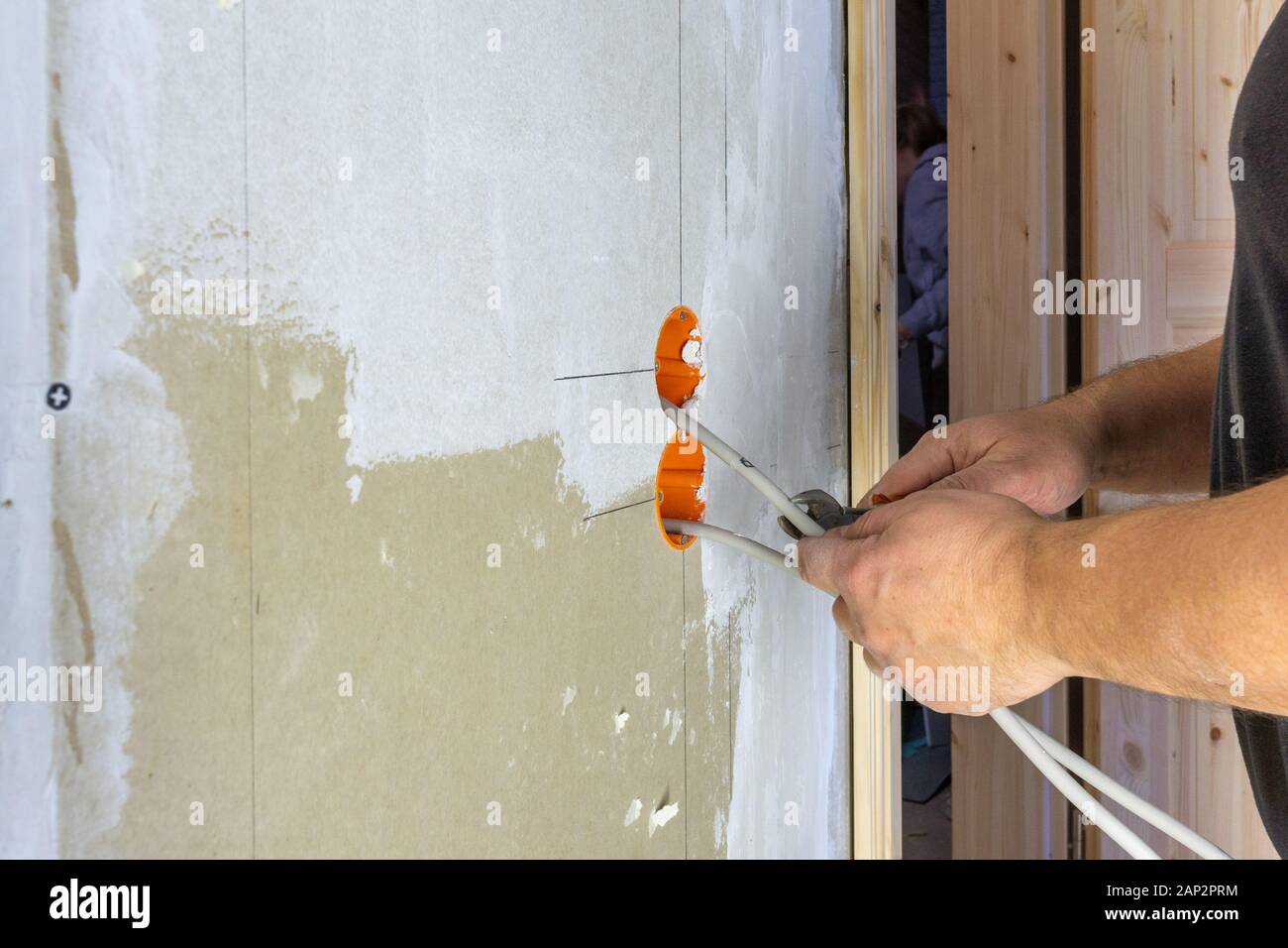 Craftsman Installing An Electricity Socket Stock Photo
