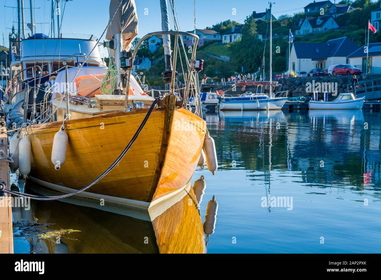 Old wooden boat in Tarbert marina. Inner Hebrides sailing trip, Scotland. Stock Photo