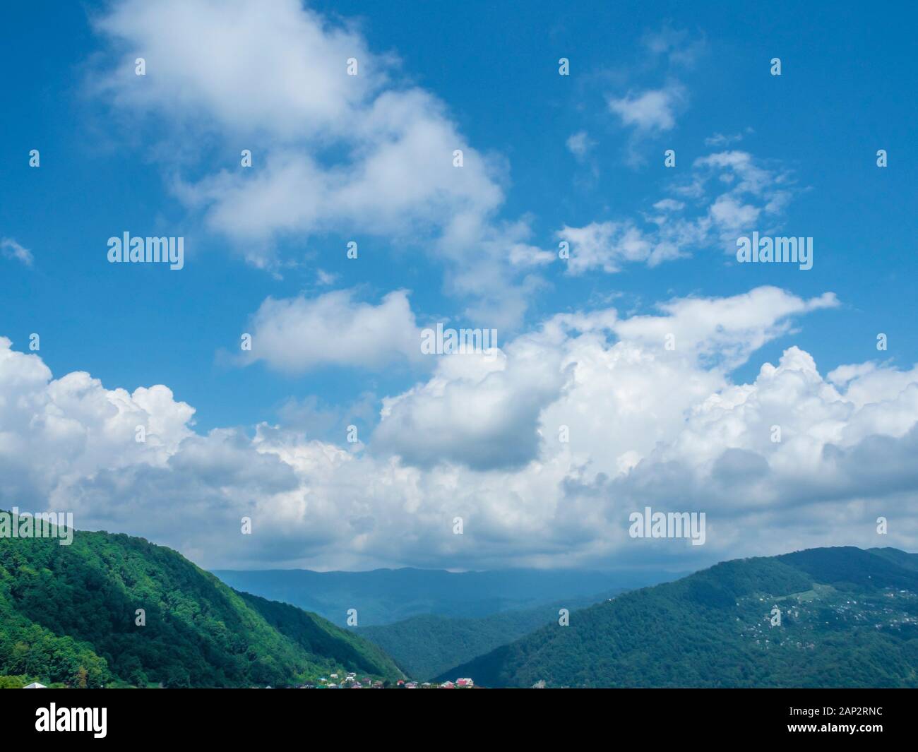 Thick white clouds over the forest Stock Photo Alamy