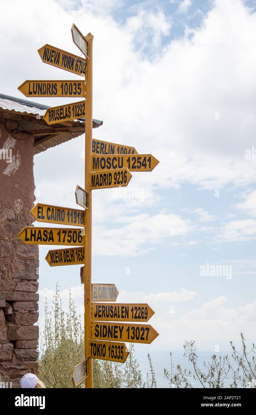 Signpost to the world at Taquile Island, Lake Titicaca, Peru Stock Photo