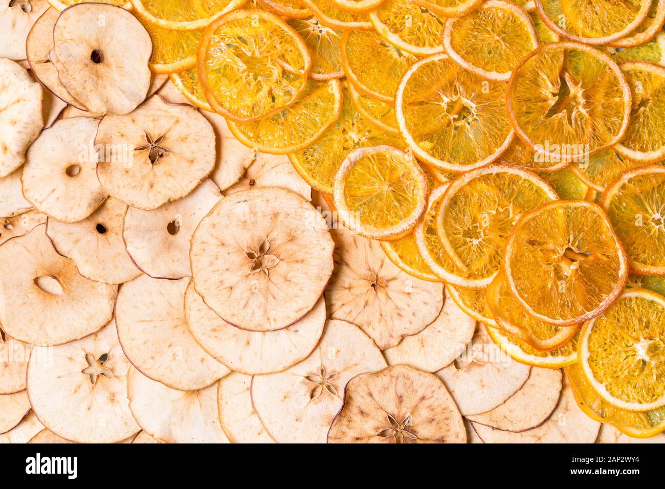 Flat lay Dried apple and orange fruit chips background Stock Photo Alamy