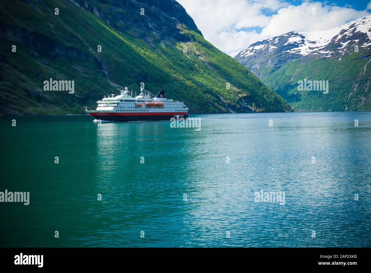 Geiranger fjord, Norway-JUNE 15,2012: the cruise ferry Hurtigruten sails along Geirangerfjord. The trip has been described as the 'World's Most Beauti Stock Photo