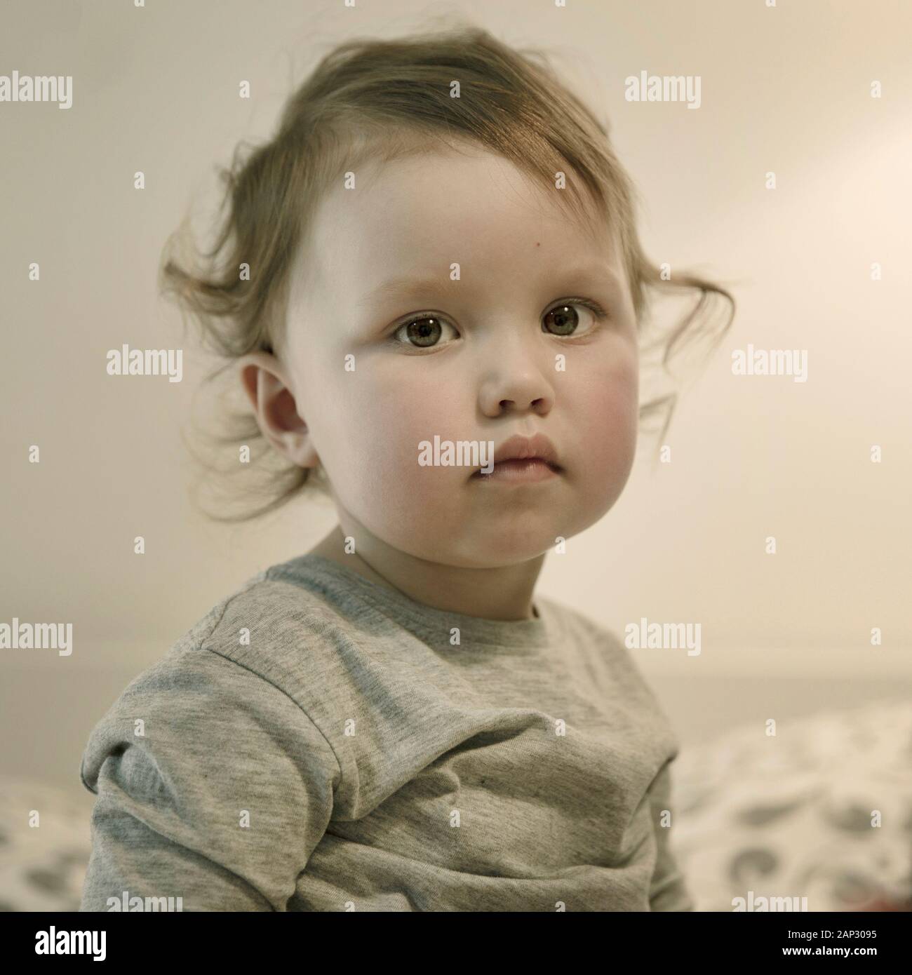 Cute Baby Girl With Blond Curly Hair Stock Photo Alamy