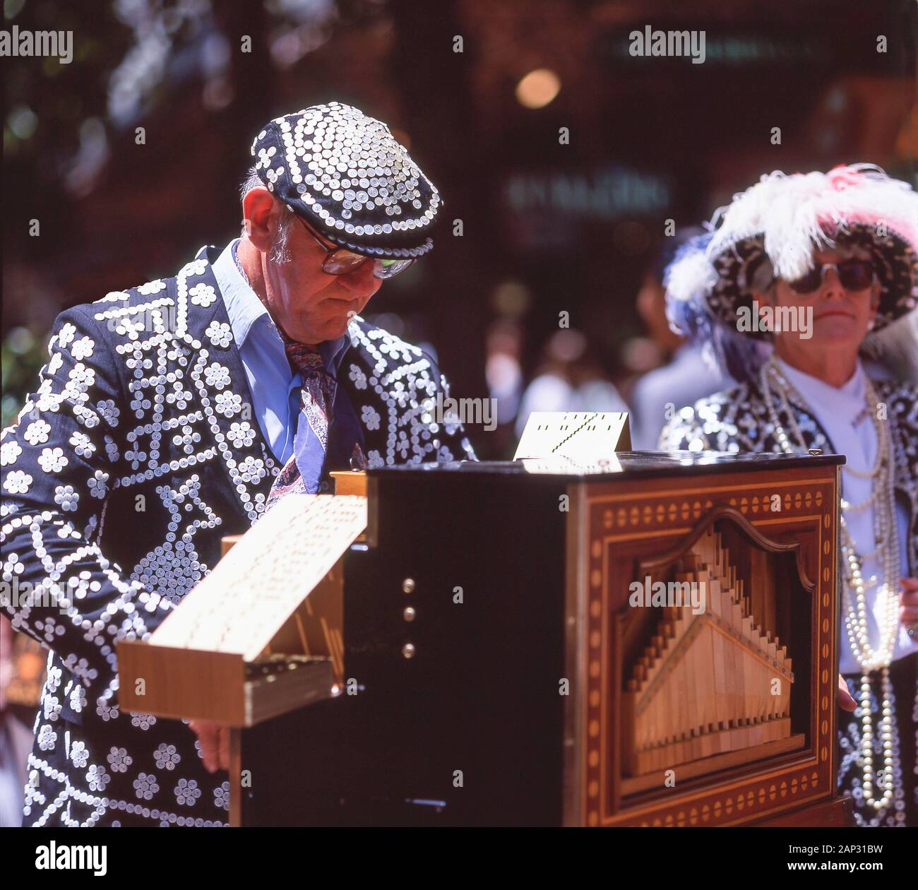 Cockney Capers Pearly King playing Verbeeck organ in street, Collins Street, Melbourne, Victoria, Australia Stock Photo