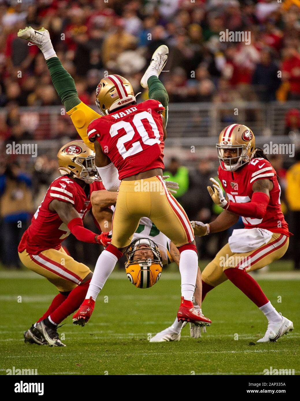 Santa Clara, CA, USA. 19th Jan, 2020. San Francisco 49ers free safety JIMMIE WARD (20) and San Francisco 49ers defensive back EMMANUEL MOSELEY (41) upend Green Bay Packers wide receiver ALLEN LAZARD (13) in the second quarter during the NFC Championship game at Levi's Stadium in Santa Clara. The 49ers won 37:20. Credit: Paul Kitagaki Jr./ZUMA Wire/Alamy Live News Stock Photo