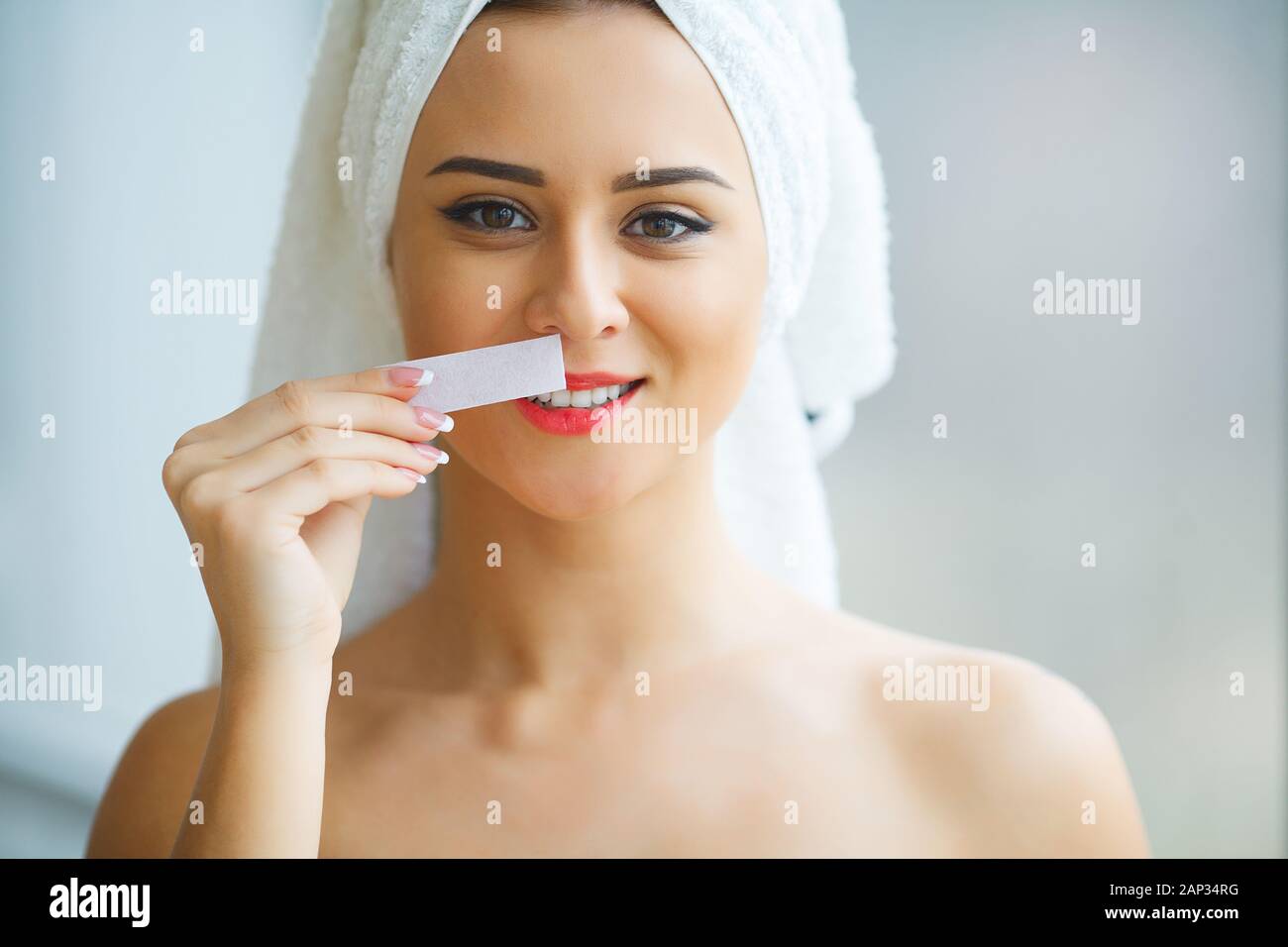 Hair Removal Wax. Young woman reciving facial epilation Stock Photo Alamy