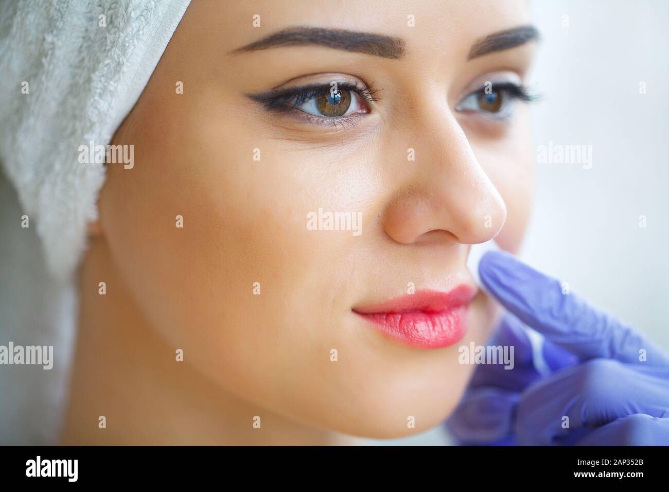 Beautician waxing young woman's eyebrows in spa center Stock Photo Alamy