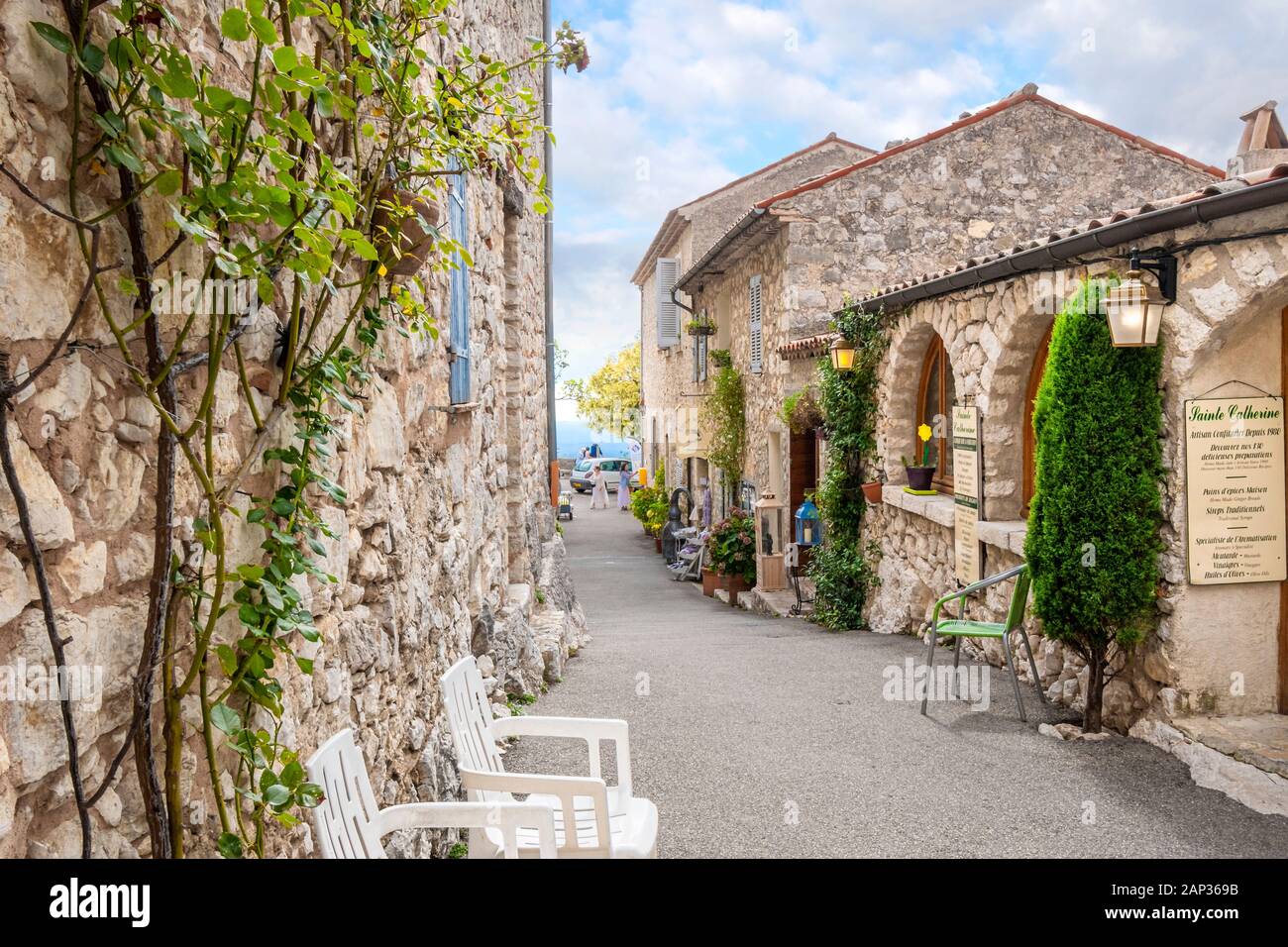 A typical quaint street of shops in the medieval hilltop village of Gourdon, France, in the Provence Alpes Maritimes area of Southern France. Stock Photo