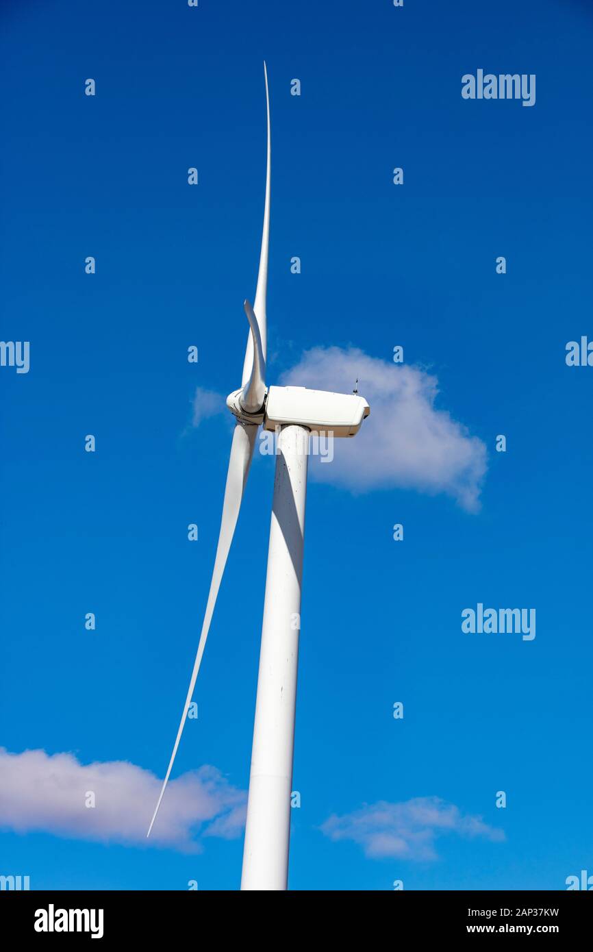 Wind turbine with blue sky and clouds Stock Photo - Alamy