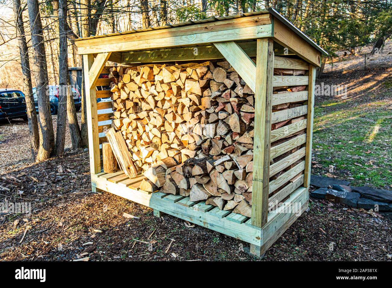 firewood rack of lumber chopped wood outside nobody Stock Photo