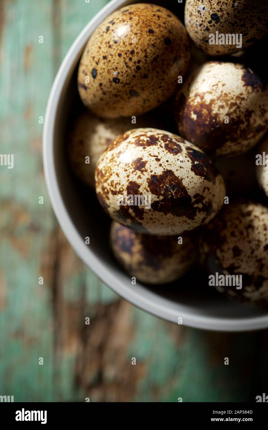 Quail eggs on a wooden table. Stock Photo
