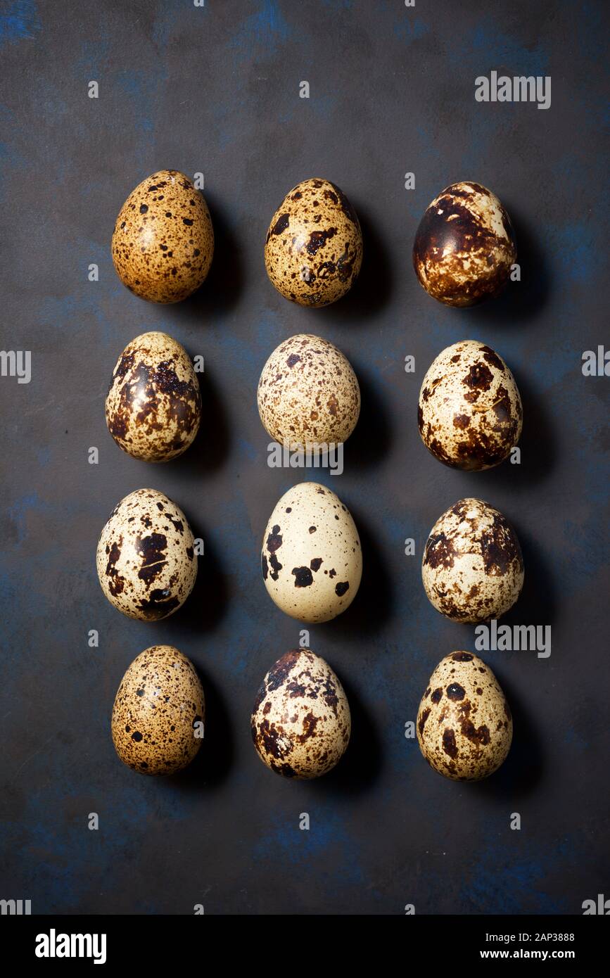 Quail eggs on a black table. Stock Photo