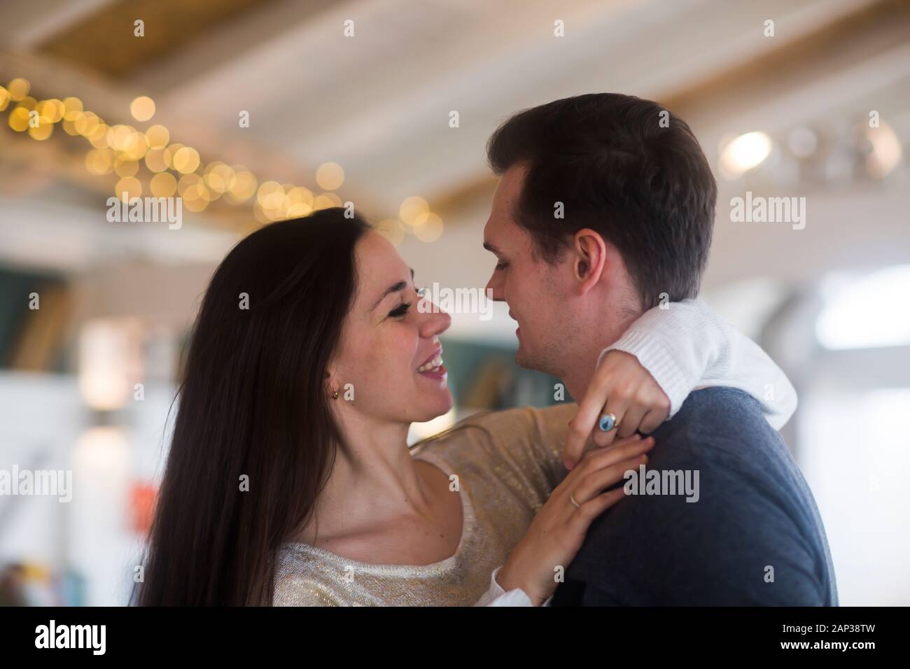 young couple dancing inside togetherness Stock Photo