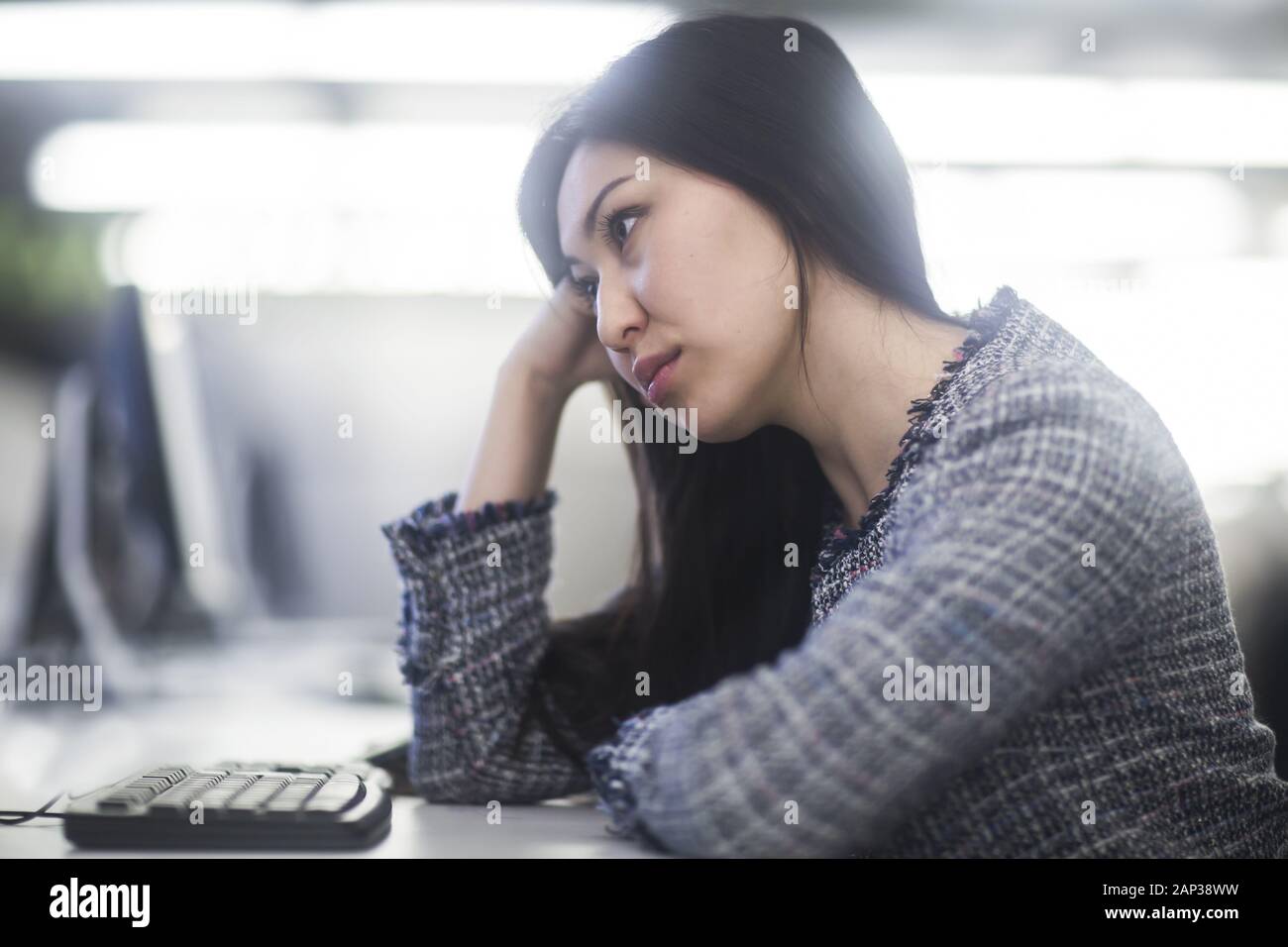 young asia woman with paper in an office revised Stock Photo