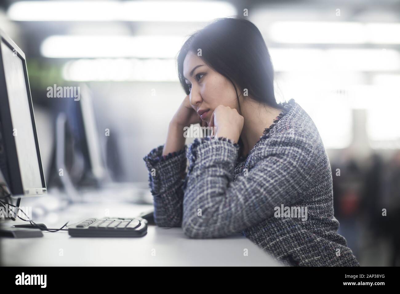 young woman inside working concentrate Stock Photo