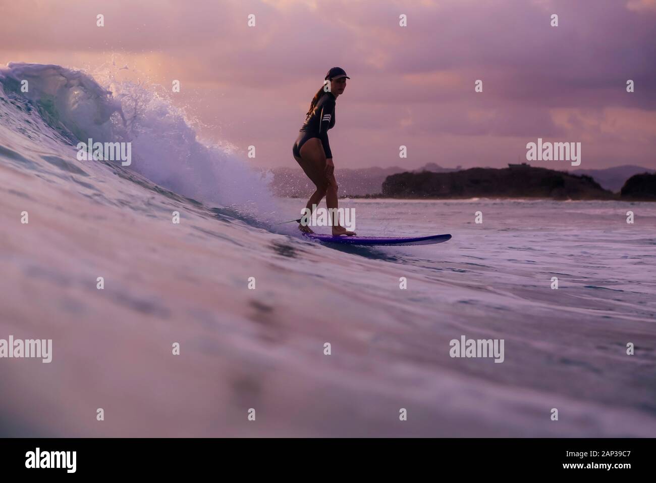 Surfing at sunset hi-res stock photography and images - Alamy