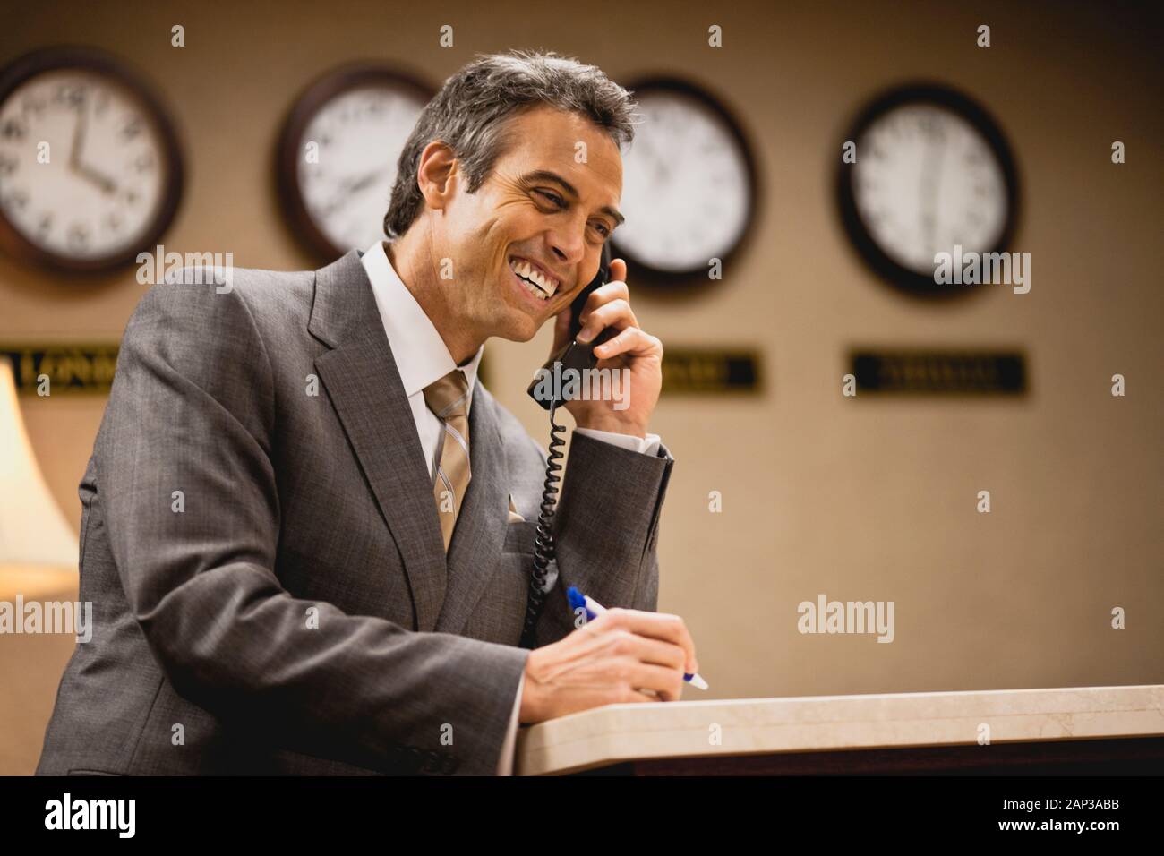 Man in suit talking on phone. Stock Photo