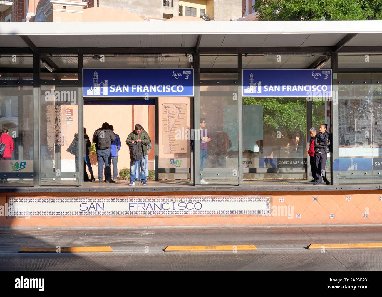 People waiting at RUTA Linea 3 publiic bus station San Francisco the