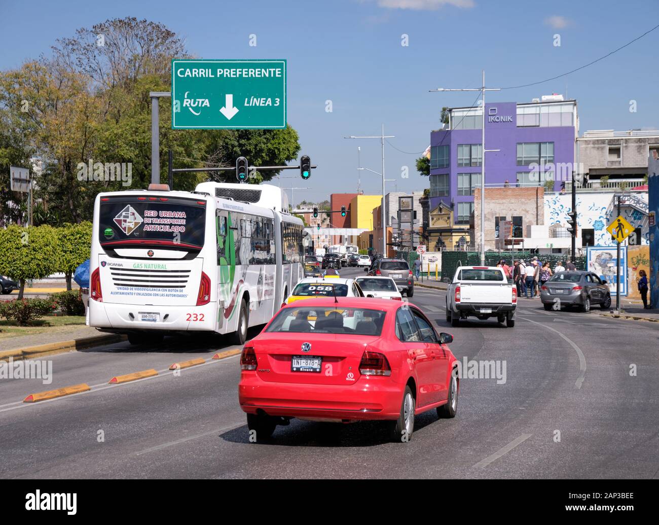RUTA Linea 3 publiic articulated bus using dedicated lanes through the centre of the city. Puebla, Mexico. Stock Photo