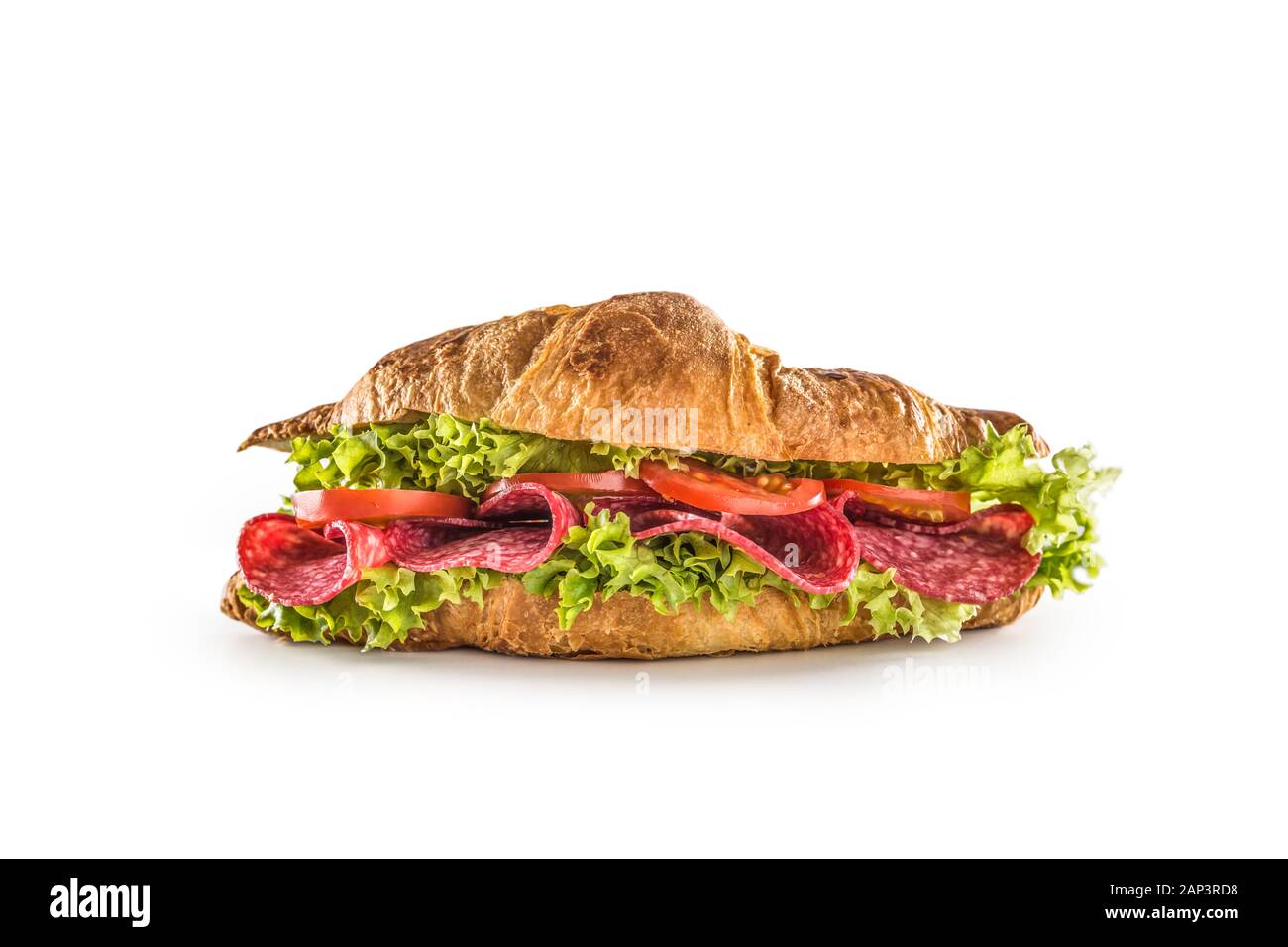 Croissant stuffed with lettuce salad salami and cheese isolated on