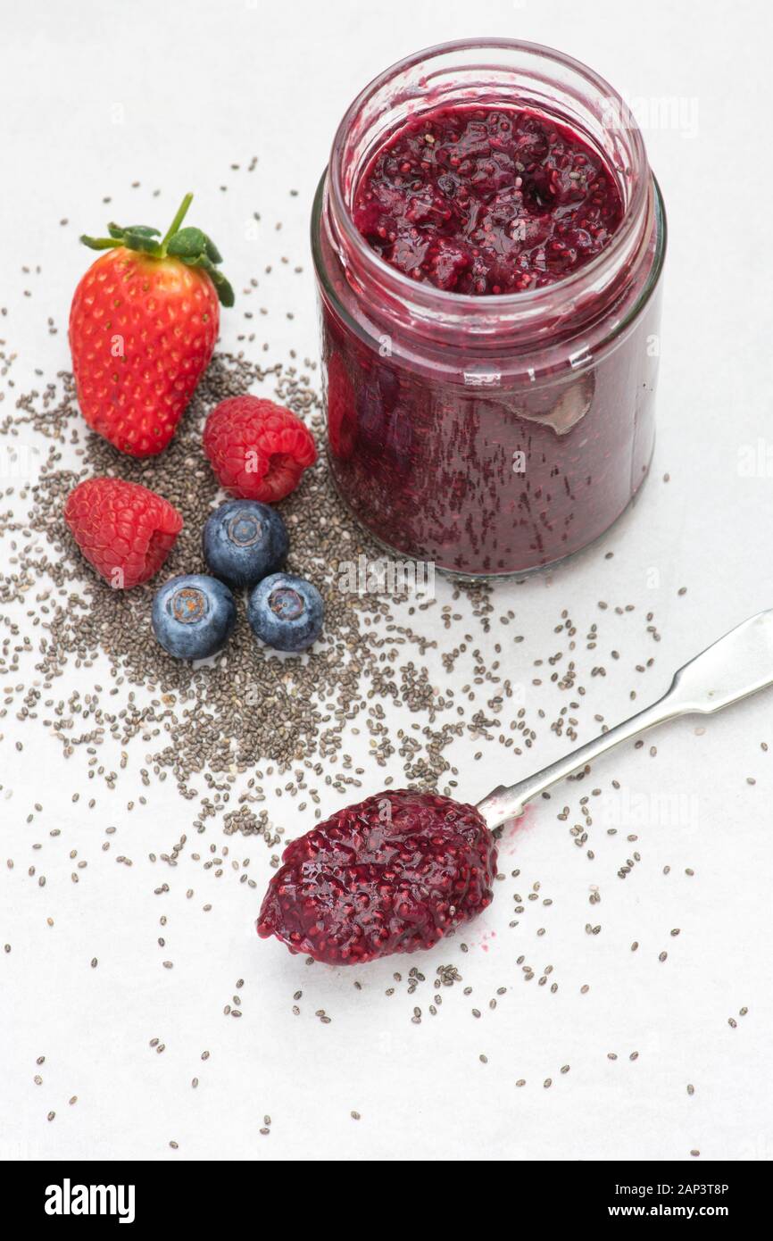 Jar of homemade chia seed berry jam with fruit and chia seeds Stock Photo