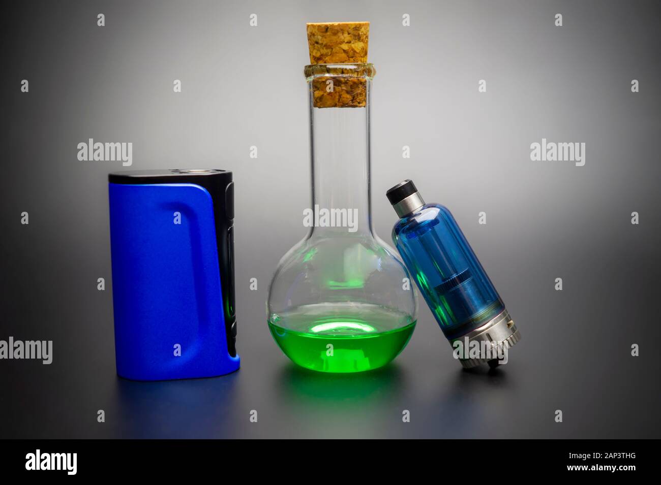 Electronic cigarette or vaping devices with cork stopped flask with vape  liquid Stock Photo - Alamy