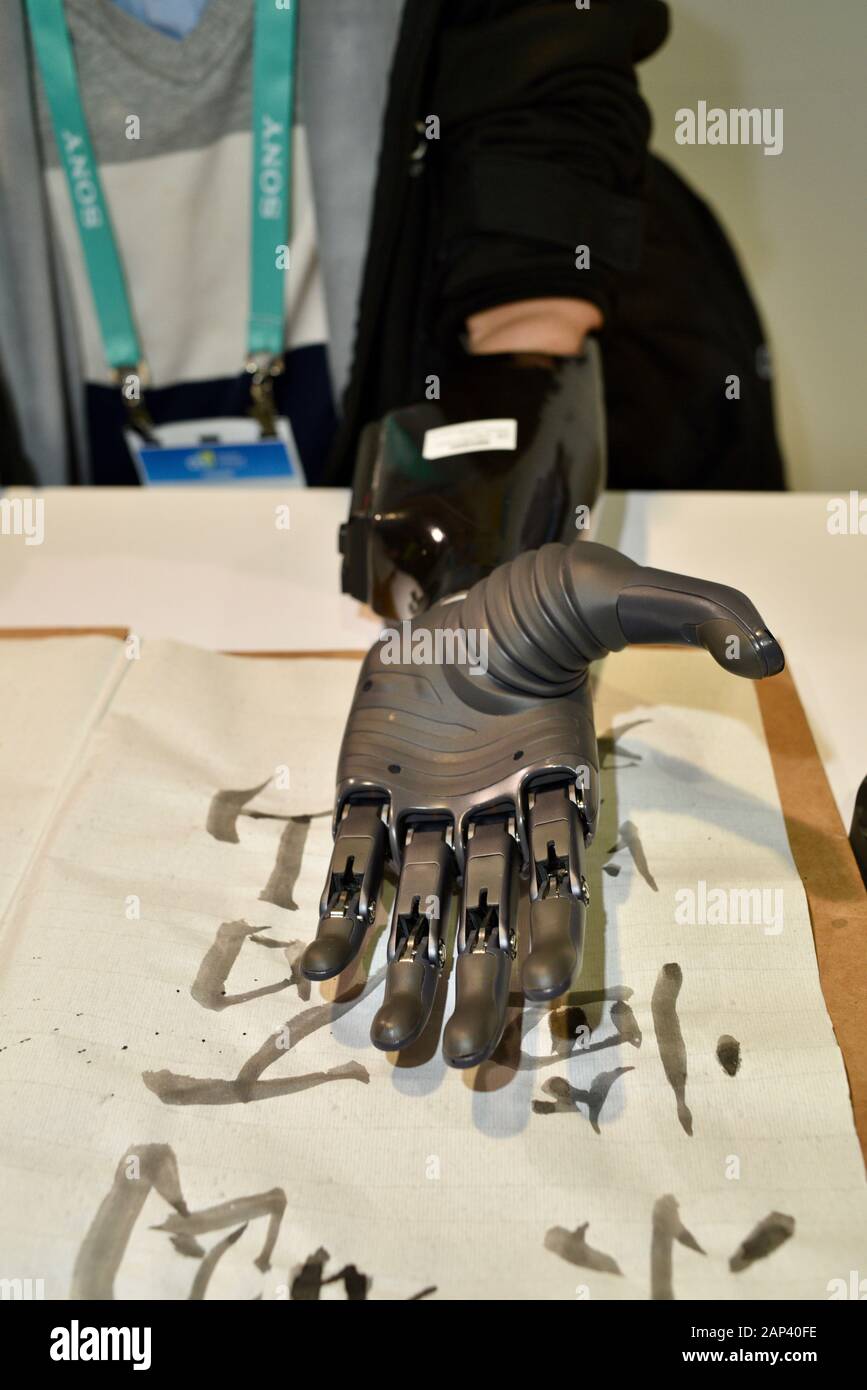 BrainCo prosthetic arm and hand using artificial intelligence and machine learning to capture nerve signals from patient to grip hand, CES, Las Vegas. Stock Photo