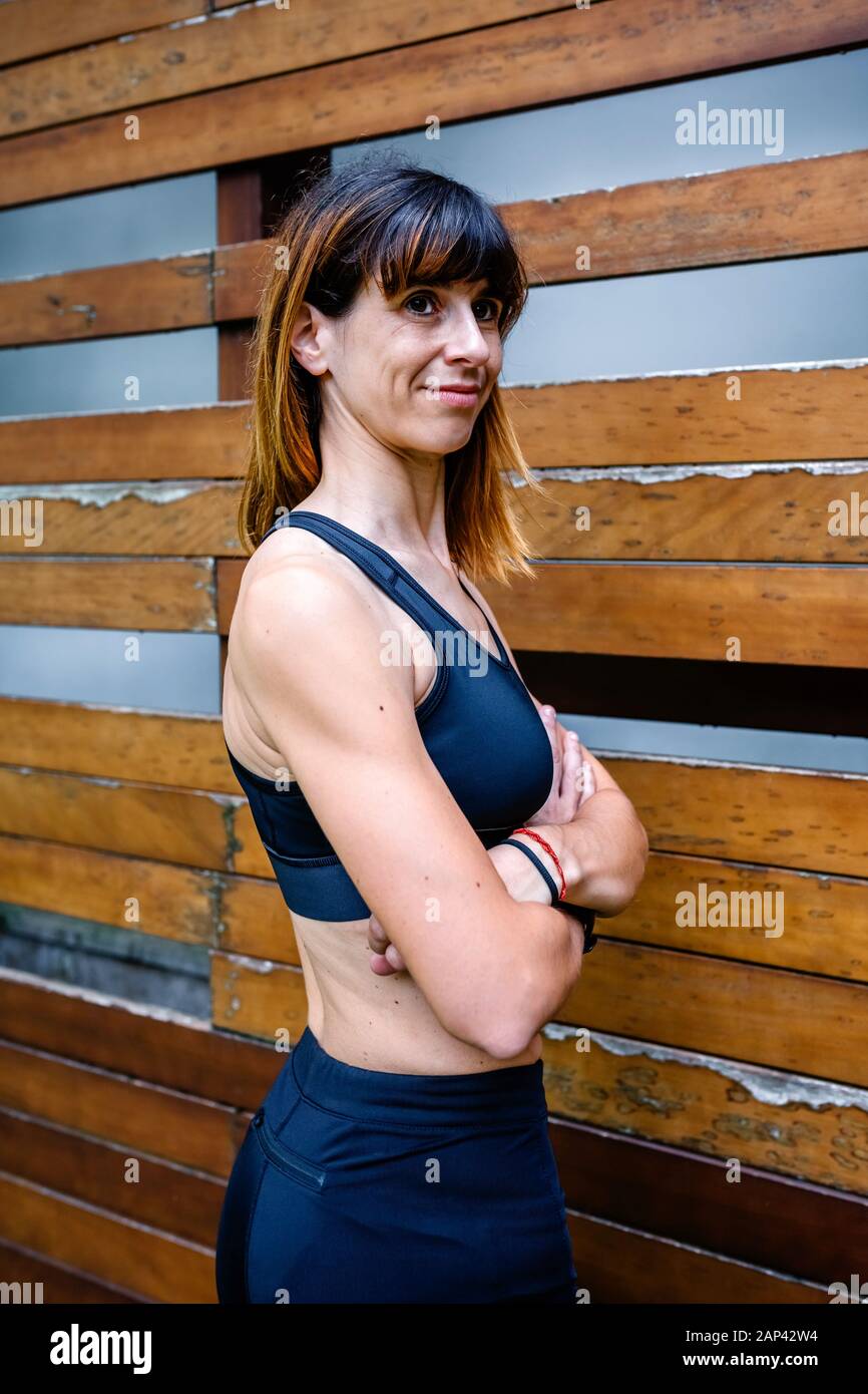 Muscular woman arms crossed hi-res stock photography and images - Alamy