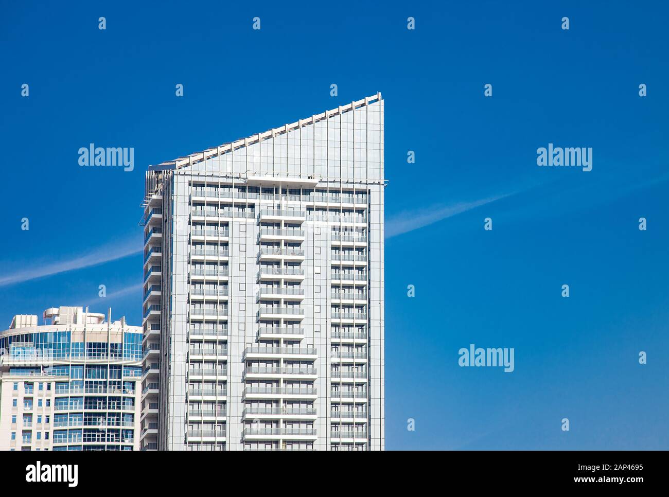 Urban Building Scyscraper Top on Blue Sky Stock Photo