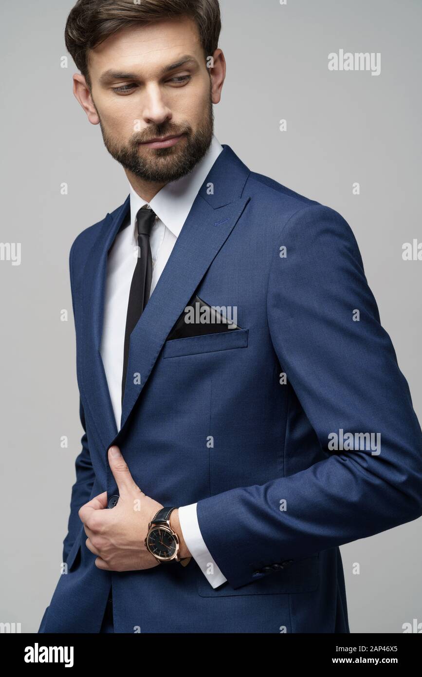 studio photo of young handsome businessman wearing suit Stock Photo - Alamy