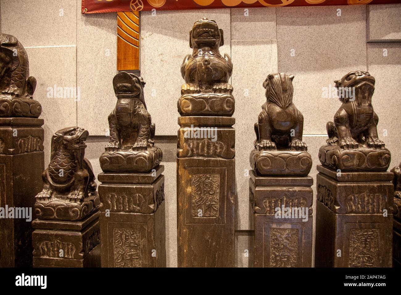Chinese Stone Statues at Jinli Restaurant on Leicester Street, Chinatown - London UK Stock Photo