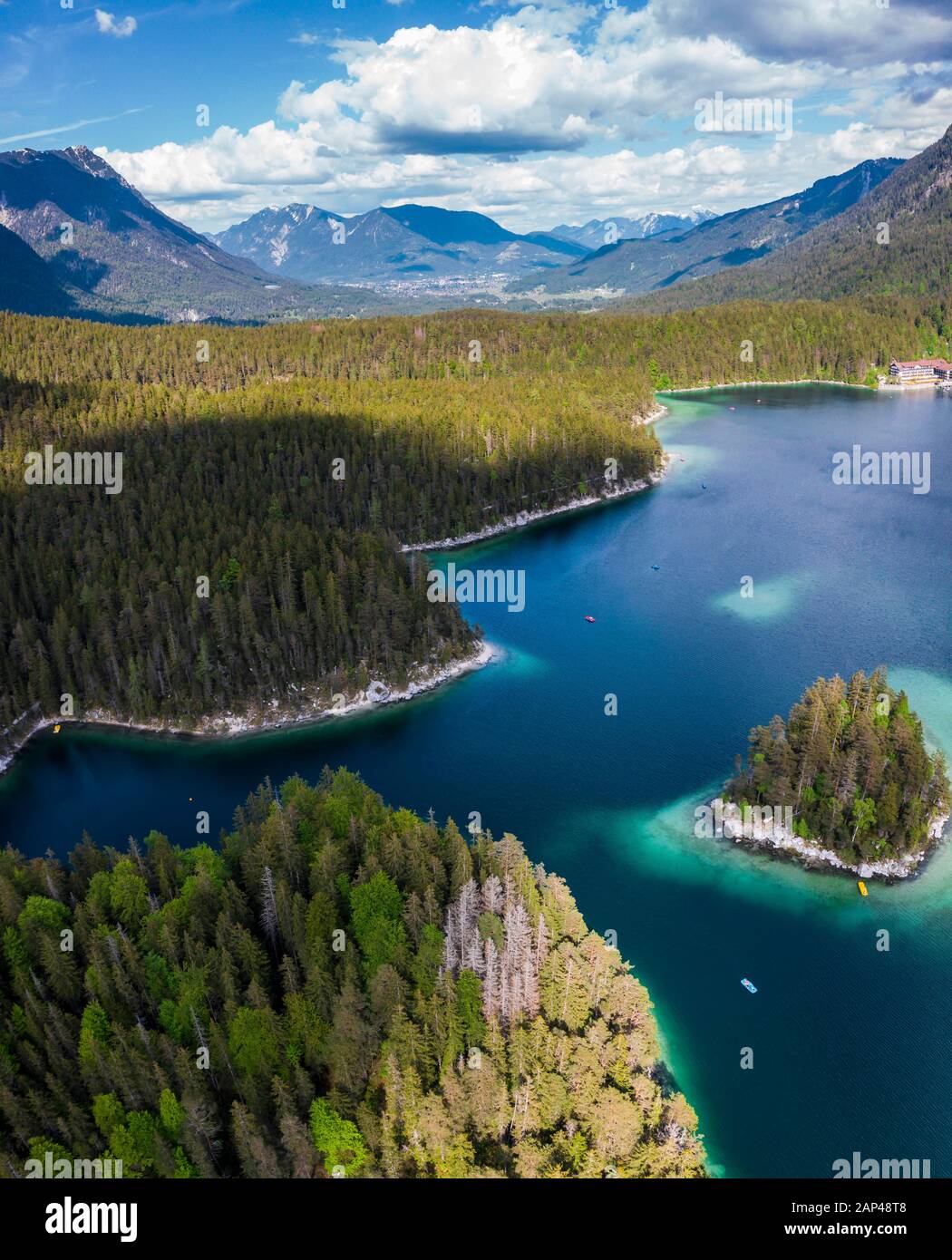 Aerial view of Eibsee lake with island, forest and mountains, near ...