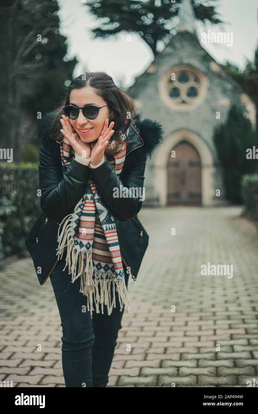 Young Brunette Turkish woman telling a smoething with hand gesture Stock Photo