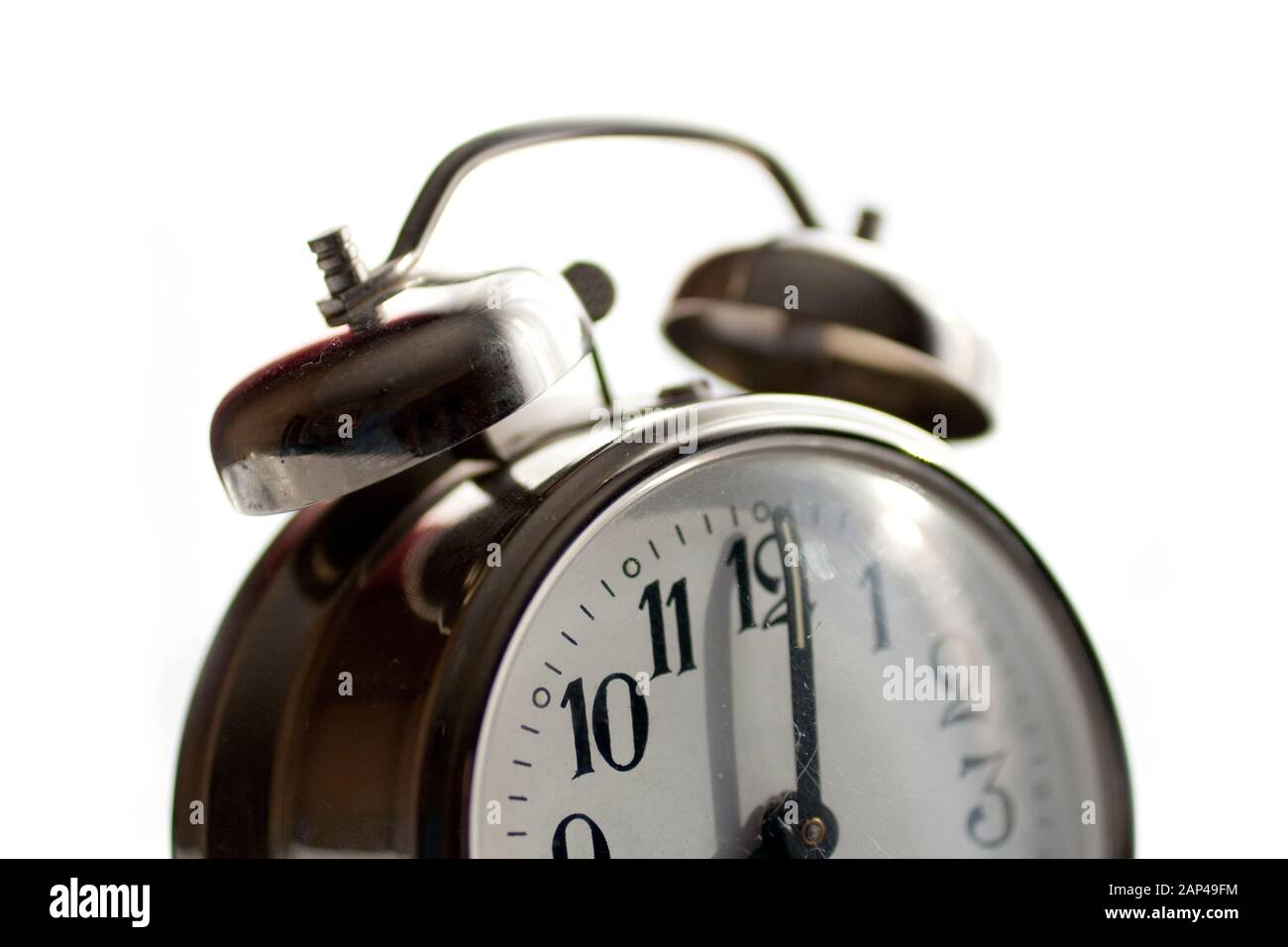 Vintage alarm clock isolated on white background Stock Photo - Alamy